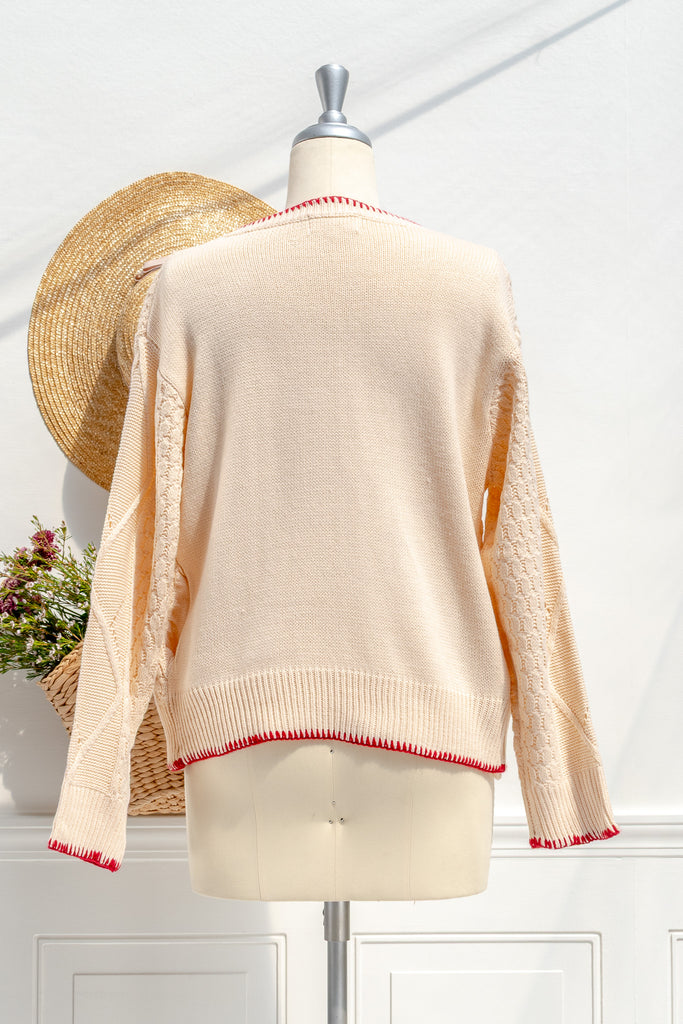 Matilda cream cardigan — back view with clean knit and red-tipped trim