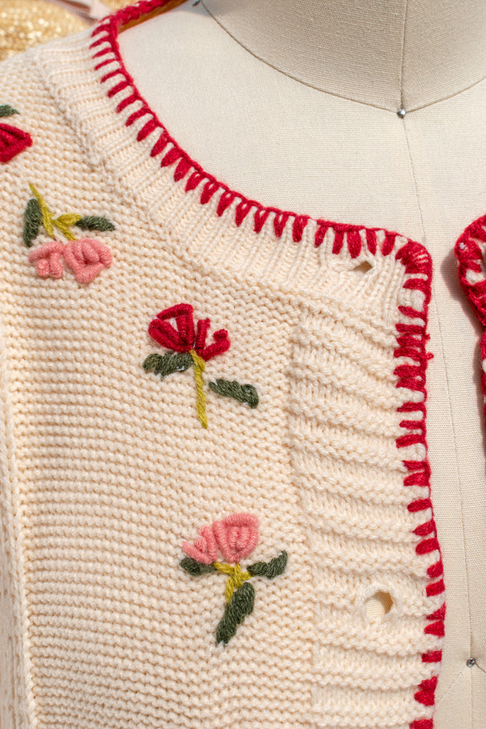 Close-up of floral embroidery along the placket on the Matilda cream cardigan
