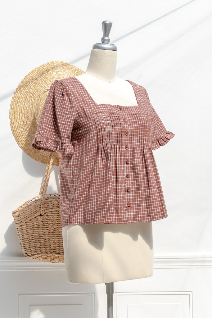 Mavis burnt umber cotton babydoll blouse — three-quarter view showing relaxed fit and ruffled sleeves
