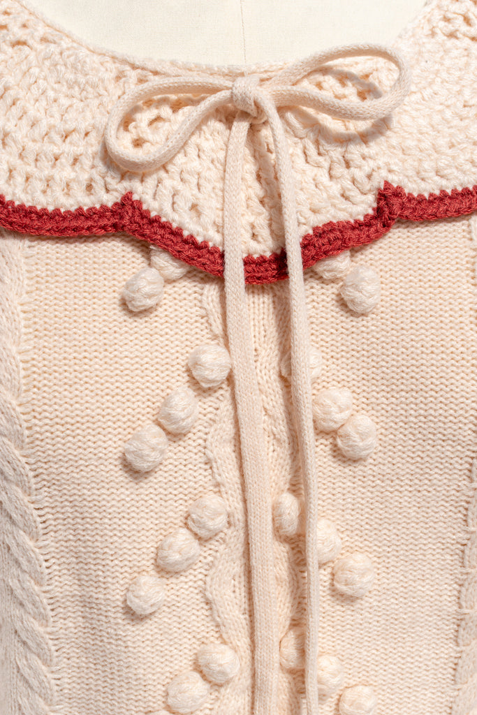 Cable-knit sleeve with bobble accents on the Piper sweater