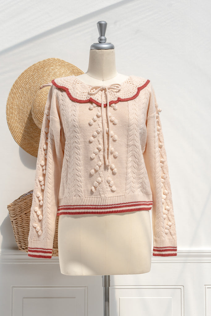Amantine Piper cream bobble-knit sweater with scalloped collar, red trim, and cropped length — front view