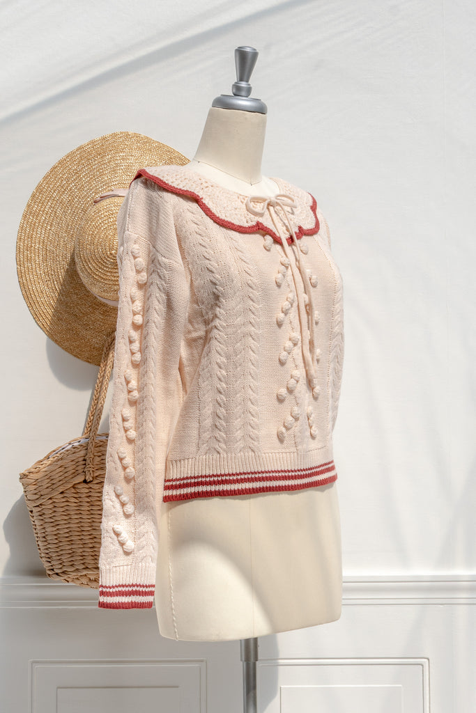 Piper scalloped-collar bobble-knit sweater in cream — three-quarter view showing tie neckline and textured stitch