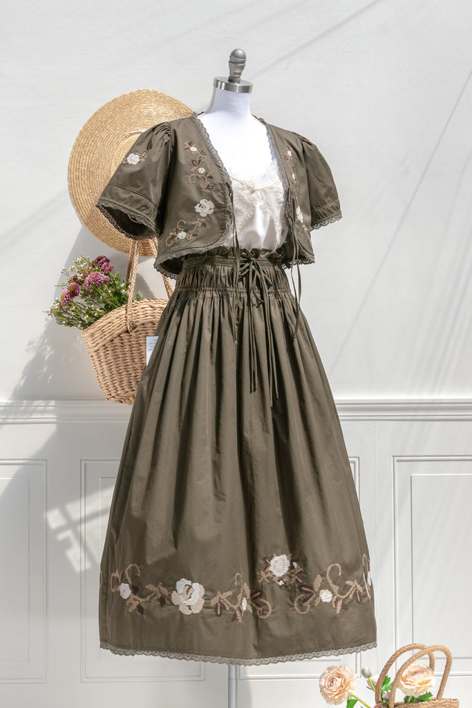 Sabrina olive embroidered cotton set — 3/4 view showing floral cross-stitch, scalloped lace trim, and gathered skirt