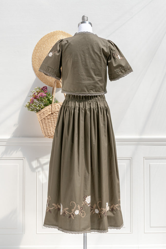 Sabrina olive two-piece set — back view with smocked waistband and clean back panels
(optional detail) Close-up of floral cross-stitch embroidery and scalloped lace trim on olive cotton