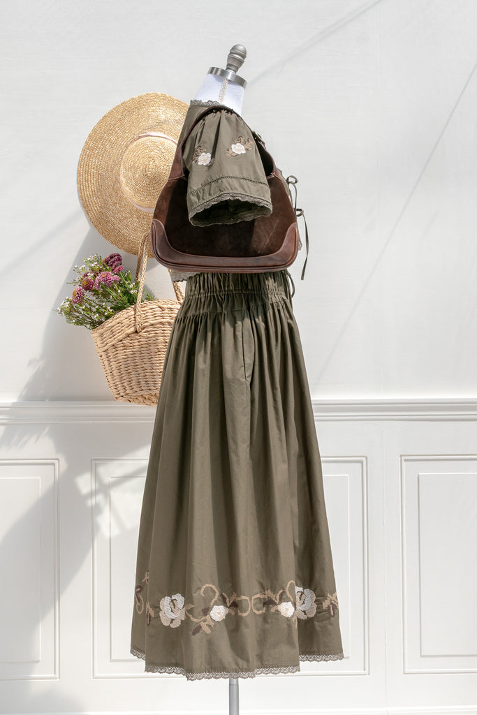 Sabrina embroidered cotton set — side view with smocked elastic waist, pocket detail, and midi length