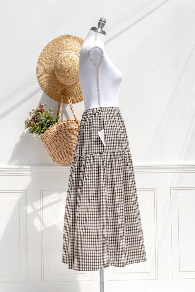 Schoolhouse plaid midi skirt — side view with soft drape and pocket detail
