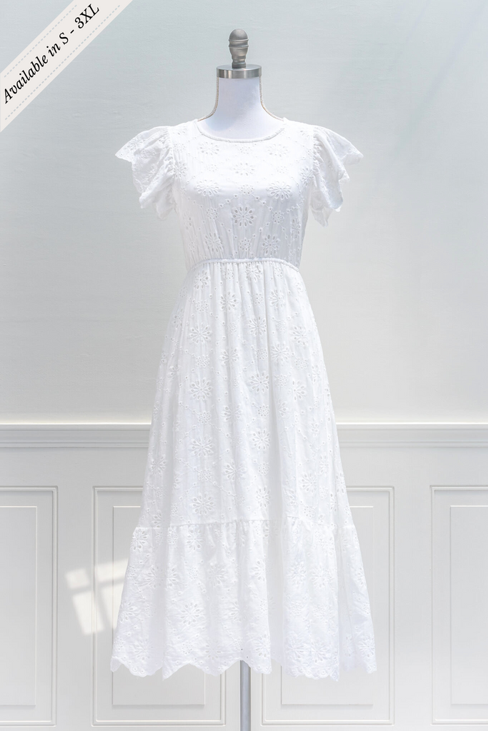 aesthetic clothes - a feminine, french inspired midi dress in white cotton, with crew neckline, cap sleeves and elastic waist. feminine french style from amantine - front view 