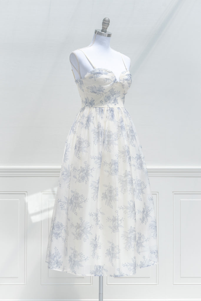 a cute boutique dress -a beautiful blue floral print organza, smocked elastic back, an a-line skirt with petticoat. front view. amantine. 