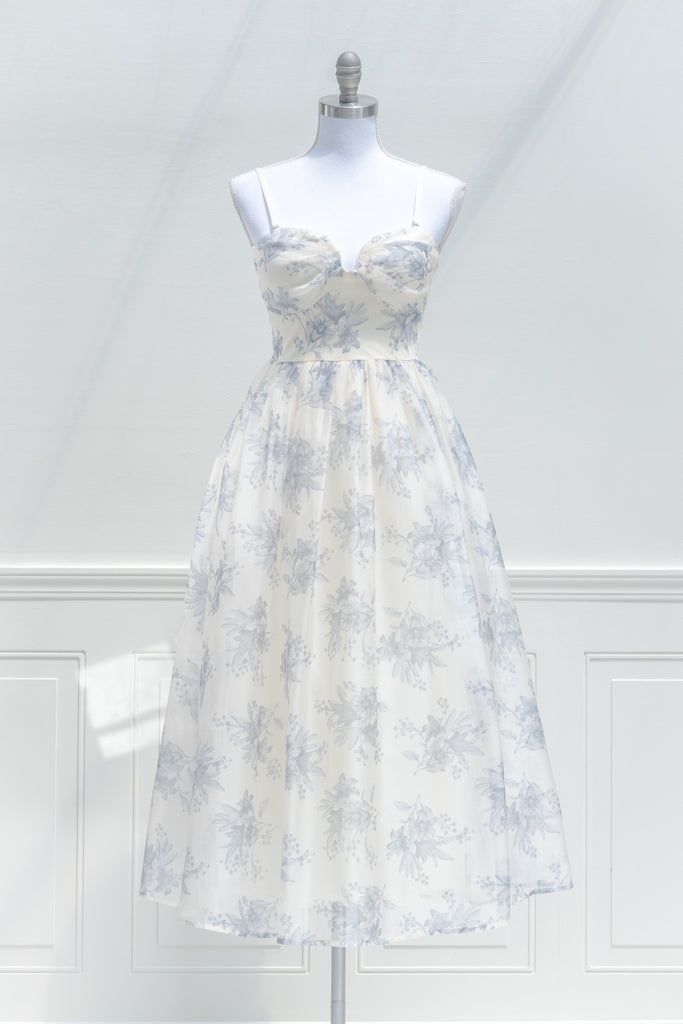 a cute boutique dress -a beautiful blue floral print organza, smocked elastic back, an a-line skirt with petticoat. front view. amantine. 