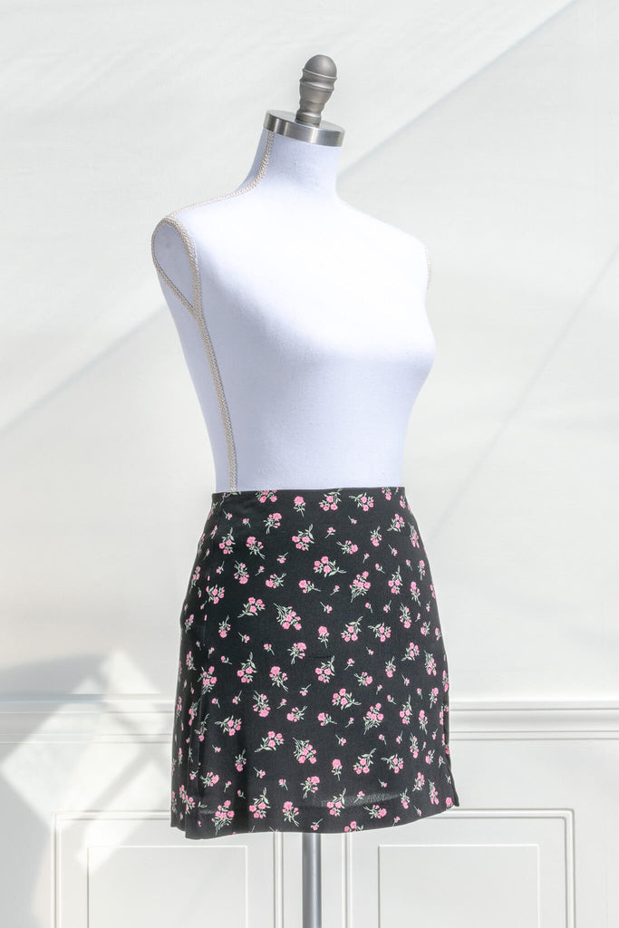 short skirts - a beautiful pink floral on black short skirt. quarter side view. amantine. 