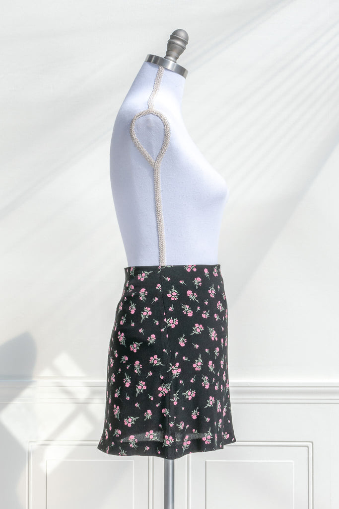 short skirts - a beautiful pink floral on black short skirt. side view. amantine. 