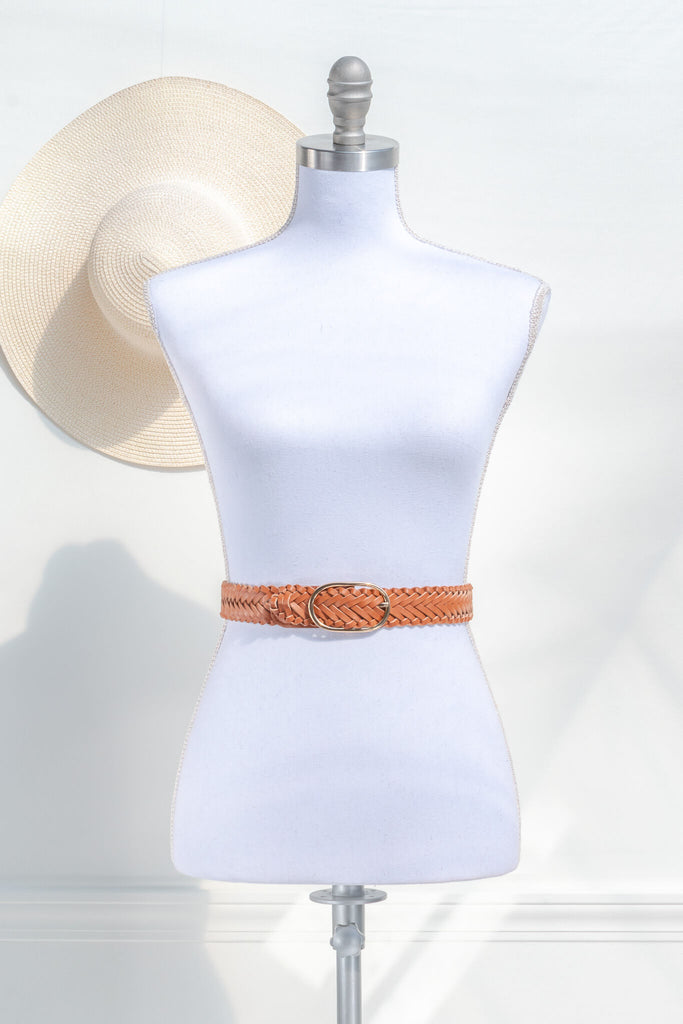 cottagecore style accessories. a french girl style classic brown braided belt. front view on mannequin amantine. 