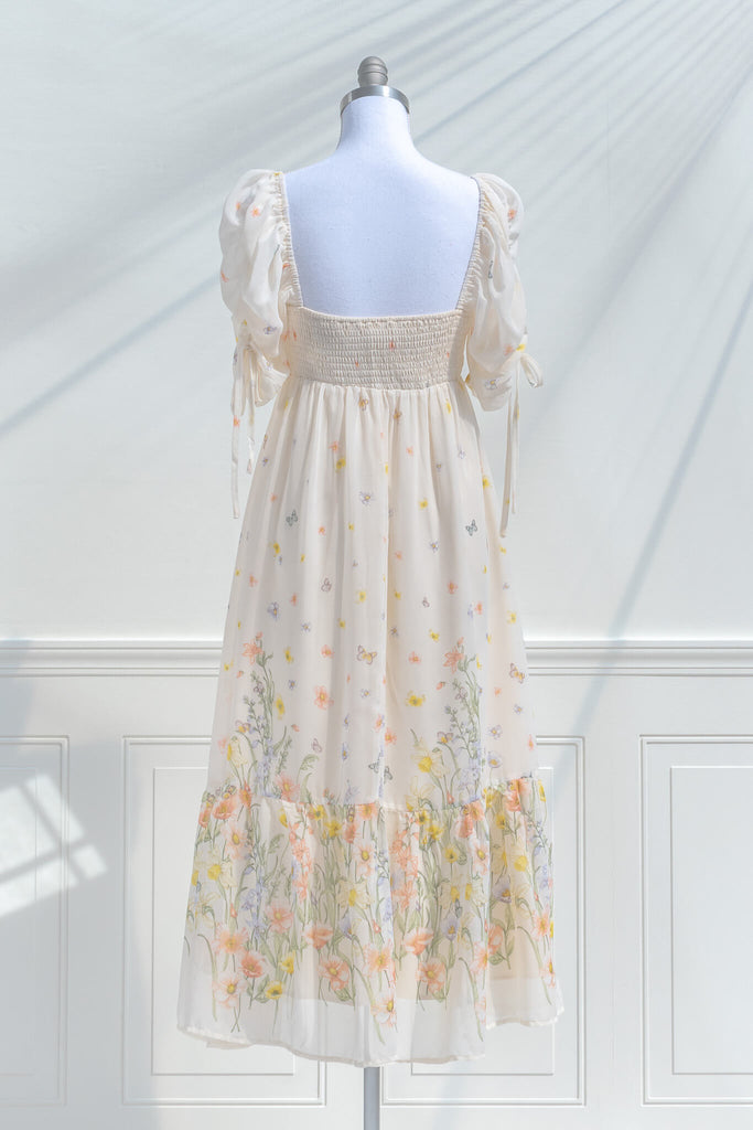 boutique dresses. a beautiful cream floral chiffon midi dress with butterfly details. Cottagecore style. back view. amantine. 