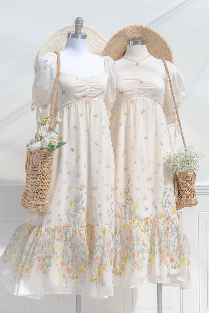 boutique dresses. a beautiful cream floral chiffon midi dress with butterfly details. Cottagecore style. with off the shoulder option styling view. amantine. 