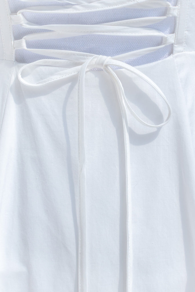 cottagecore dress - a beautiful long white cotton dress for spring. bow detail view. amantine boutique dresses. 