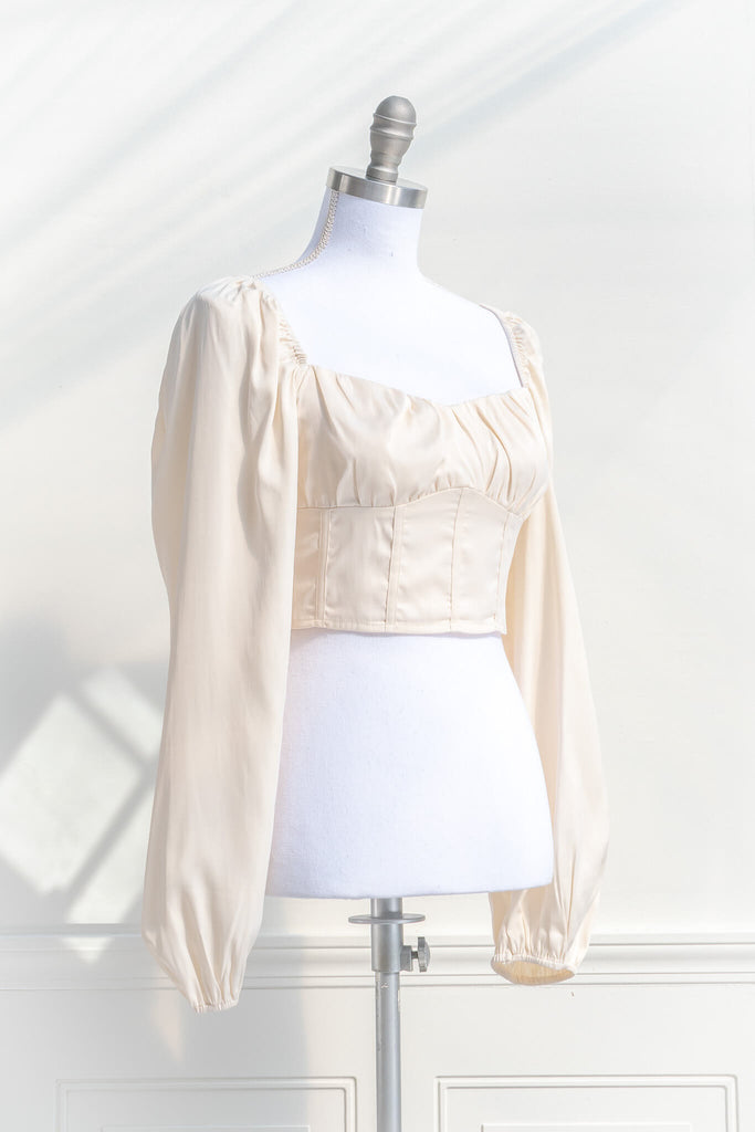cottagecore outfits - a feminine top with long sleeves, bodice, and square neckline. quarter side view. amantine. 