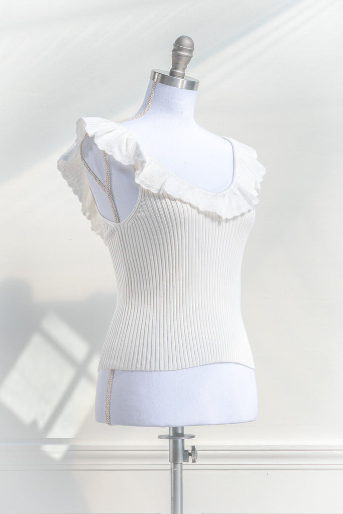 cottagecore outfits - a cottage core feminine top in french style. frilled neckline, sleeveless, and ribbed knit bodice in white. quarter view - amantine.