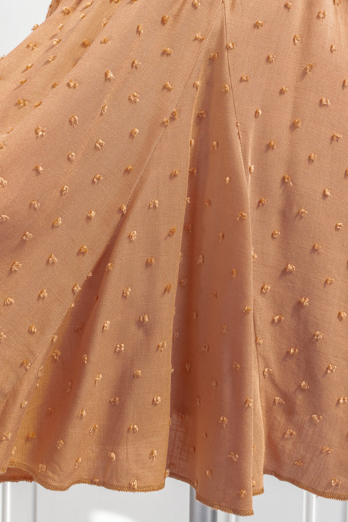 short skirts - an orange, swiss dot, short skirt in a french and feminine style. up close  view of the fabric and gusset detail. amantine.
