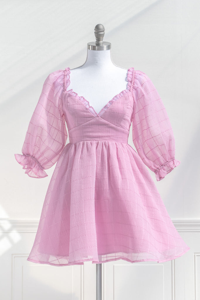 pink dresses. a puff sleeve french and feminine style sweetheart neckline pink dress. front view. 