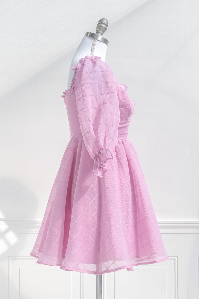 pink dresses. a puff sleeve french and feminine style sweetheart neckline pink dress. side view. 