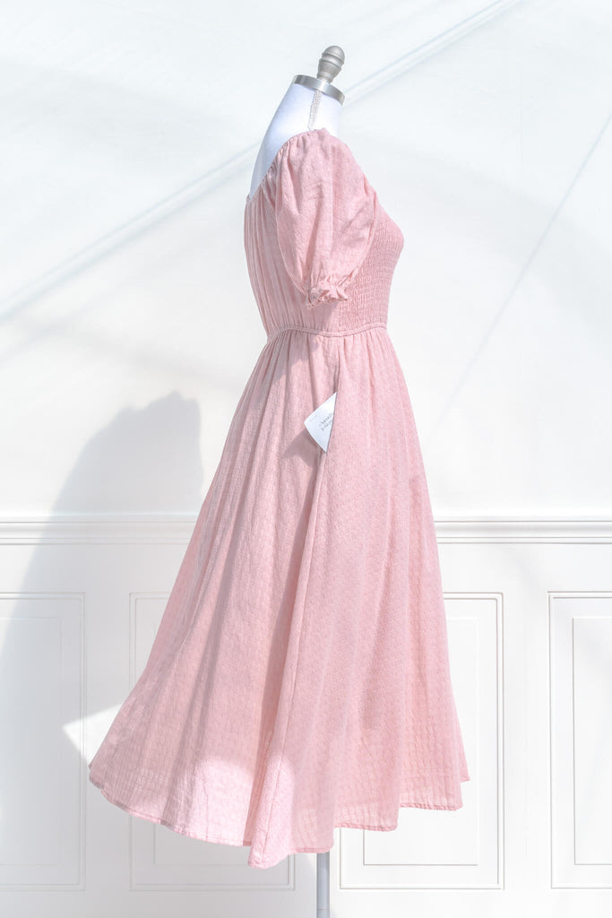 pink clothing, a lovely cottagecore style pink dress with puff sleeves, and lined a line skirt. side view showing pocket - amantine. 
