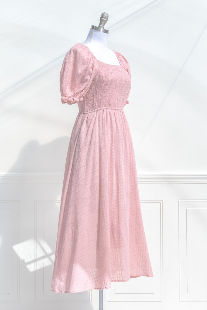 pink clothing, a lovely cottagecore style pink dress with puff sleeves, and lined a line skirt. quarter side view - amantine. 