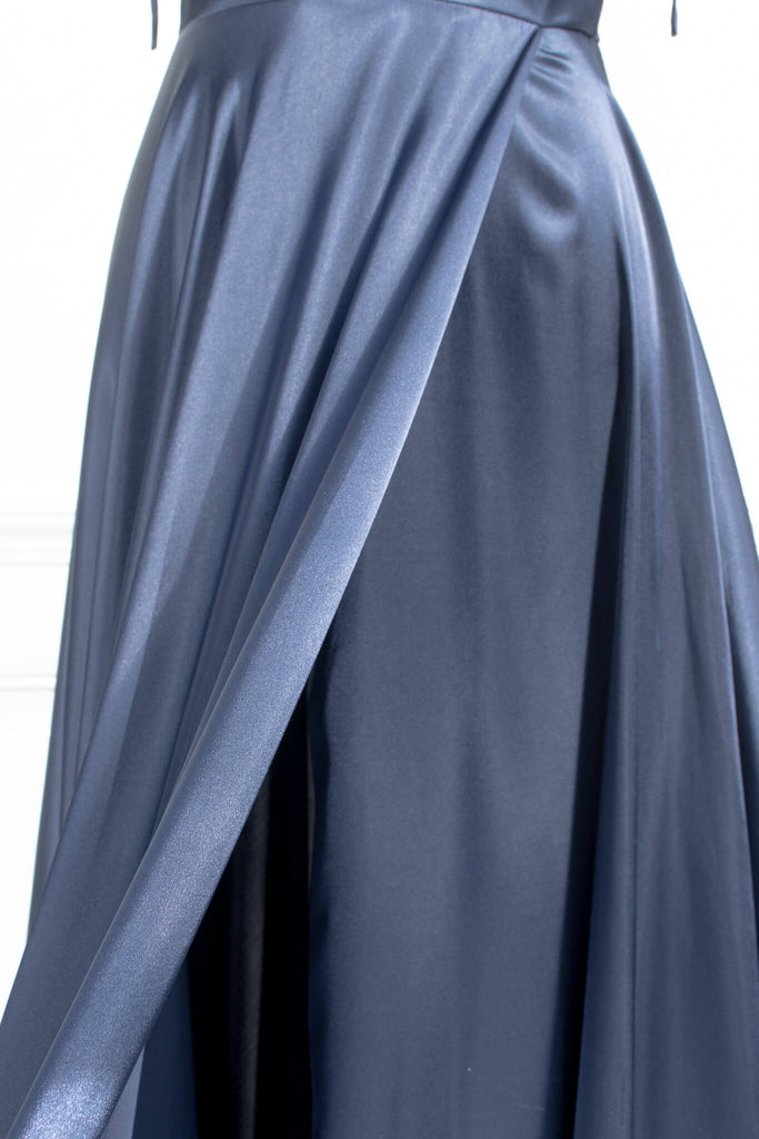 boutique dresses french style - a long blue satin prom dress, with a cowl neckline, spaghetti straps, and a stunning full sweeping gown skirt. up close fabric view. amantine.
