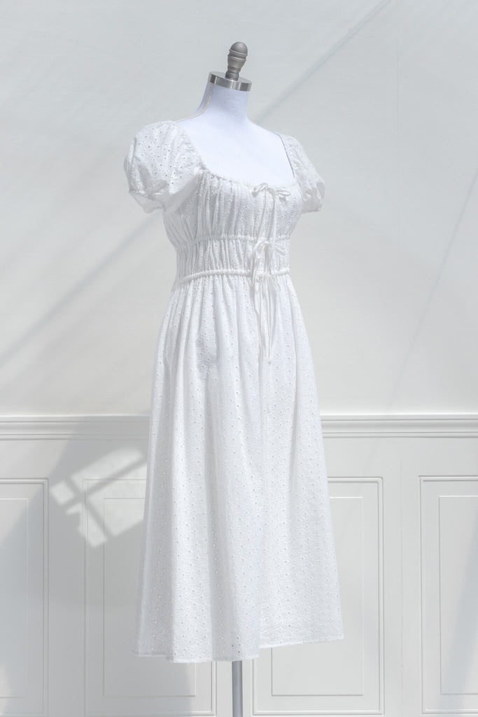 cottagecore dress - a chemise a la reine or marie antoinette style dress. square neckline, puff sleeves, midi length. quarter side view. 