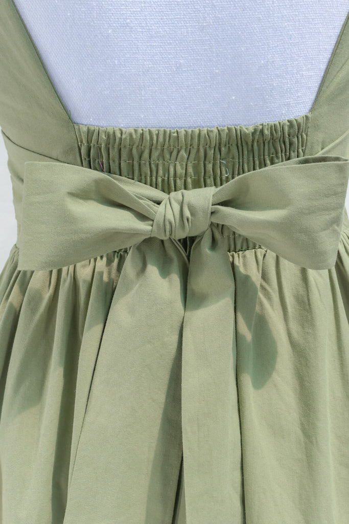 cottagecore dress - a beautiful puff sleeve, mini dress with a square neckline. back bow detail view. amantine.