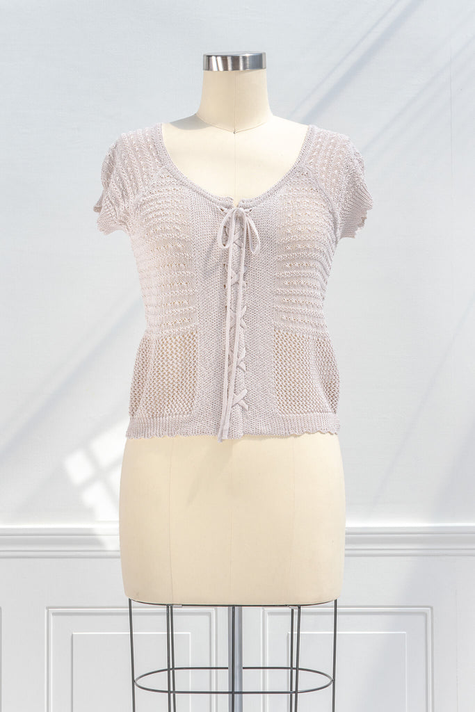 pink clothes - a feminine top with a corset tie front detail and crochet fabric. front view. 