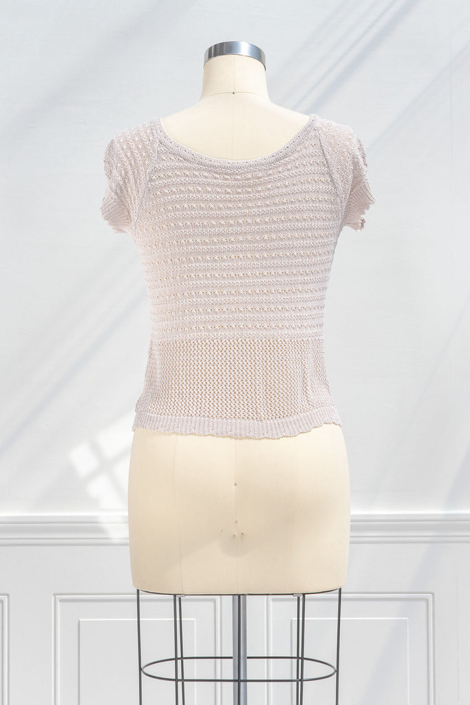pink clothes - a feminine top with a corset tie front detail and crochet fabric. back view. 