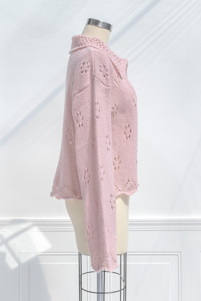 pink clothes - a pink button down cardigan with an oversized colar and oversized sleeves. feminine pink clothes. side view. 