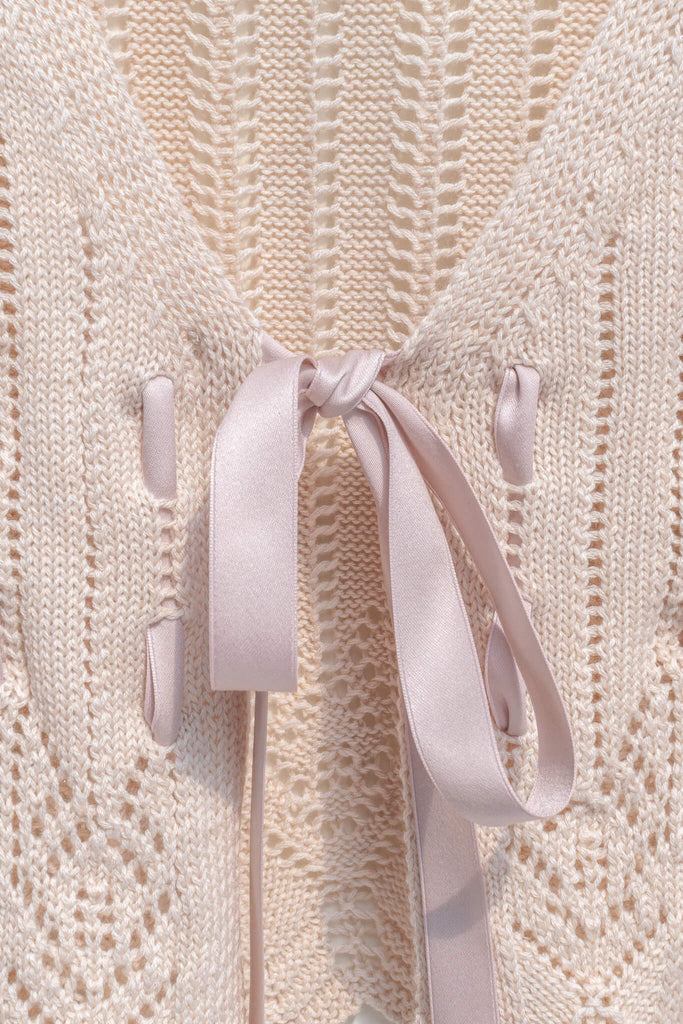 pink outfits - a beautiful and unique front tie cardigan with oversized sleeves and delicate knit details. front ribbon tie detail. amantine. 