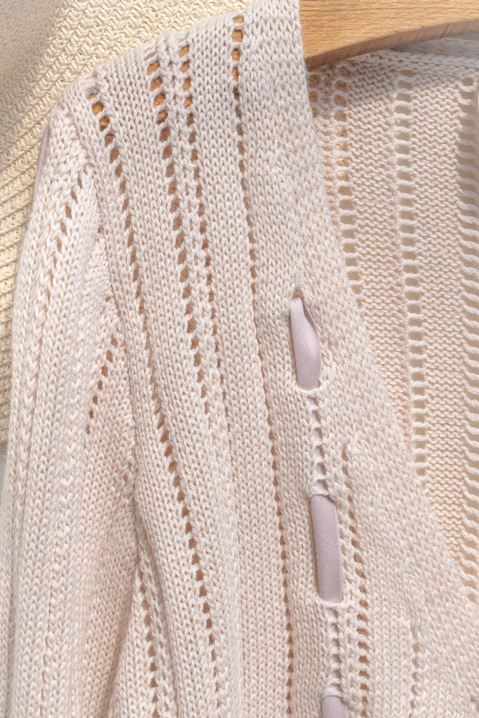 cable knit and ribbon inlay detail on feminine cottagecore cardigan. 