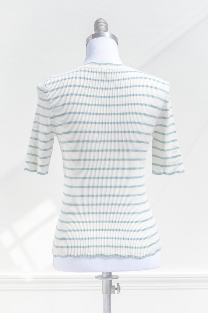 feminine french style tops - a french striped sweater top with 3/4 sleeves and scalloped edges on neckline, sleeves, and hem. cottagecore outfit. back view. amantine. 