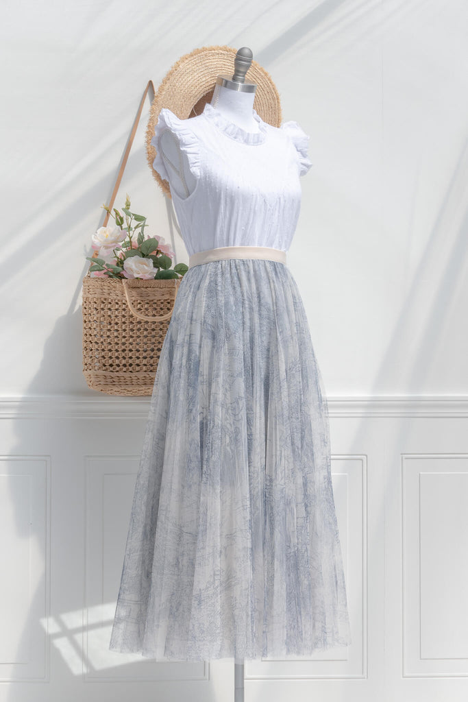cottagecore outfit with a tulle skirt, white french style blouse, hat, and french tote. 