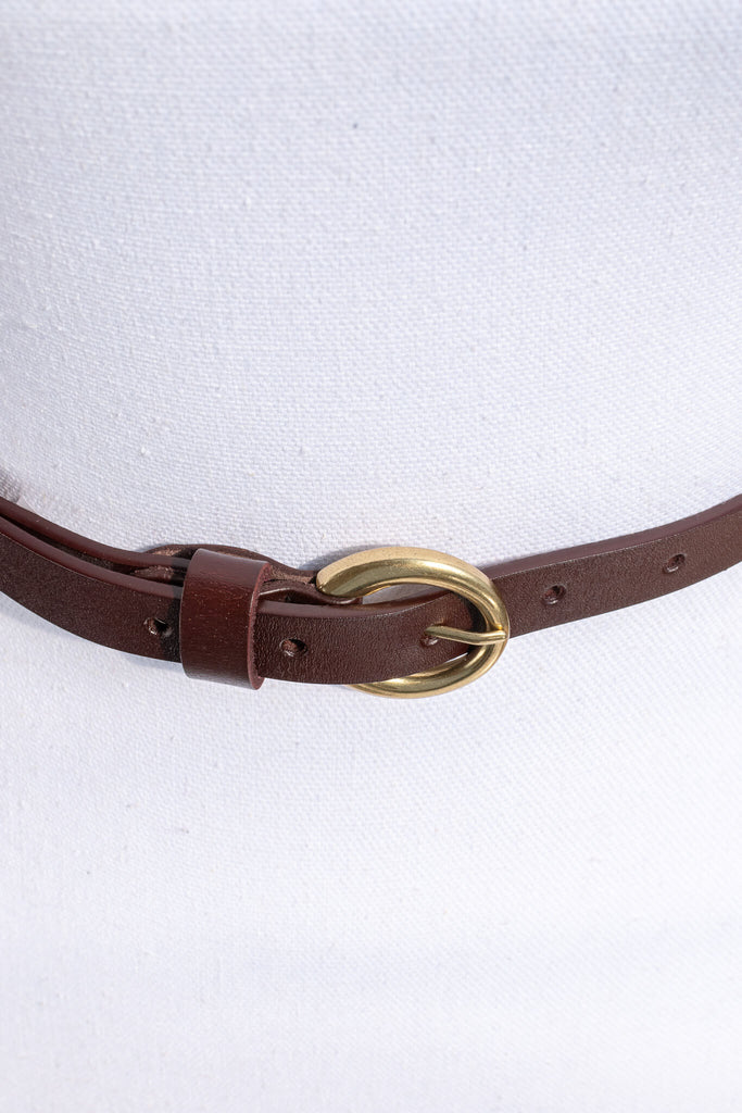 thin classic belt with round buckle for women. 