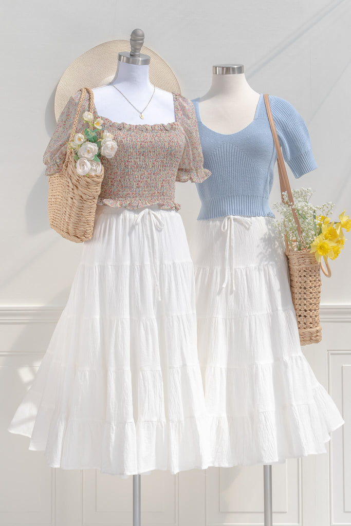 two feminine cottagecore and cottage core outfits with long white skirts and feminine tops. 