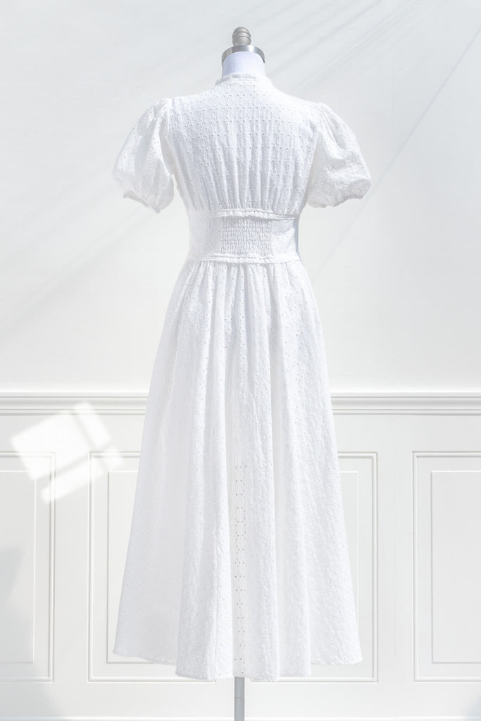 boutique cottagecore dresses - a lovely white dress with button-down feature, and puff sleeves. back view. amantine.