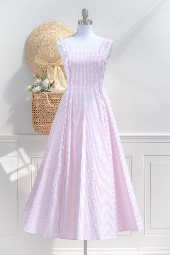 boutique dress - french girl style - pink dress with scalloped edges and bow detail. front view. amantine
