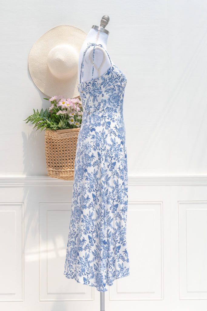 feminine french style dress - a beautiful blue floral on white dress. sweetheart neckline, spaghetti dress, perfect for summer brunches, dates, and even for workwear. side view. amantine.