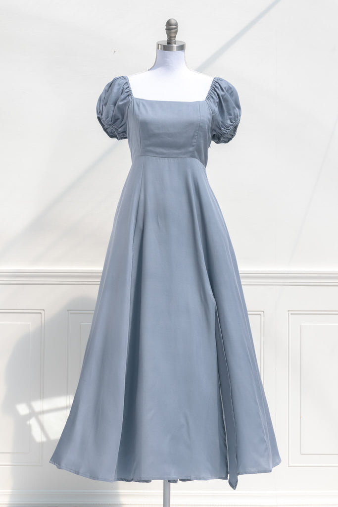 cottagecore dresses - a french inspired feminine dress in light blue, with puff sleeves, a line skirt, and high waistline - front view. amantine.