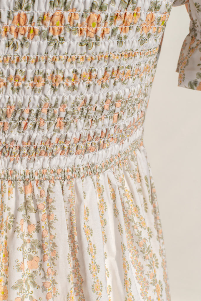 cottagecore dress with square neckline, puff sleeve, regency style, maxi length. Featuring a classic French vintage beige floral print. Front view. Amantine.