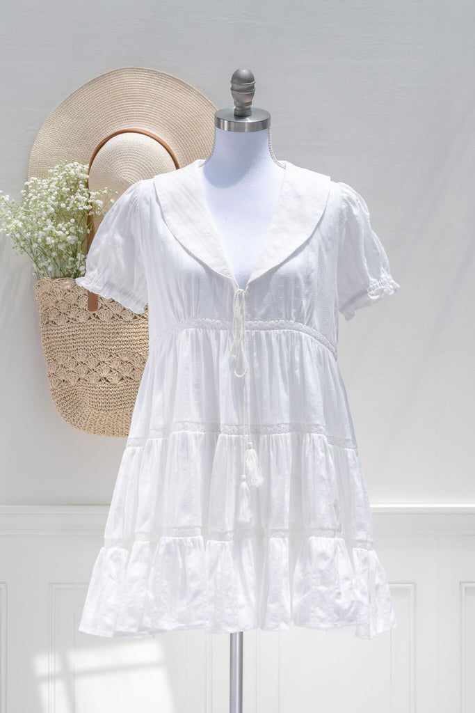 white cottagecore dresses - a sailor collar little white dress.  front view. amantine dresses. 