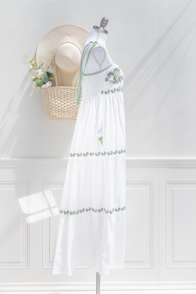 cottagecore dress - a lovely white a-line dress with tiered skirt, embroidered bust, and spaghetti straps. side view of pretty dress. 