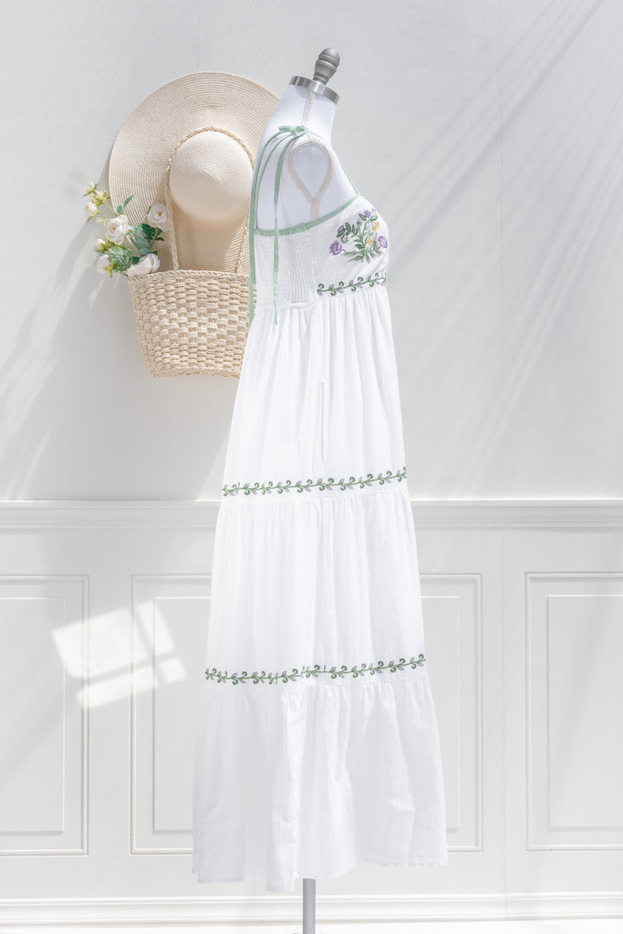 cottagecore dress - a lovely white a-line dress with tiered skirt, embroidered bust, and spaghetti straps. side view of pretty dress. 