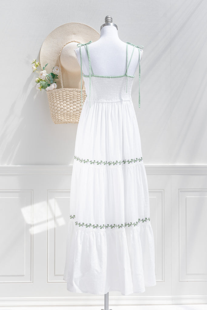 cottagecore dress - a lovely white a-line dress with tiered skirt, embroidered bust, and spaghetti straps. back view of pretty dress. 