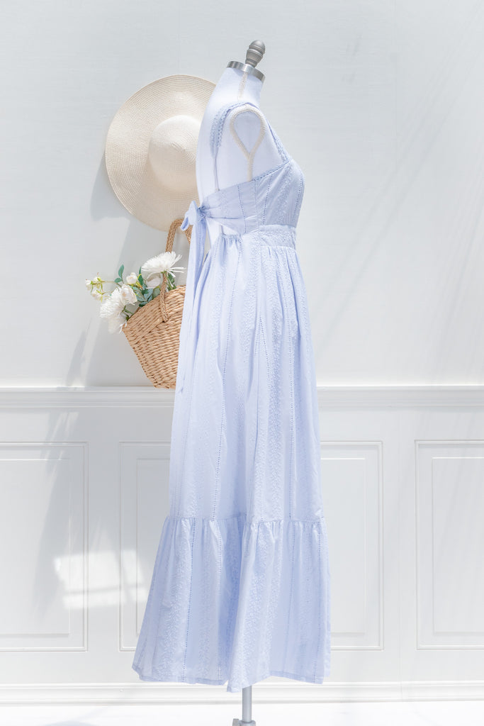 a 100% cotton dress featuring romantic eyelet lace fabric, a higher waistline for a regency-inspired silhouette, a flattering square neckline. A perfect cottagecore and castlecore aesthetic. side view. amantine.