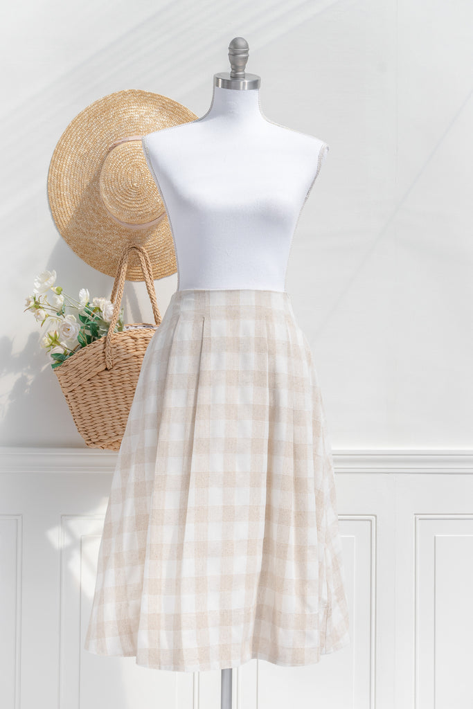 cottagecore dresses for spring. a cottagecore skirt outfit featuring a white and beige checkered pattern on crisp linen. Front view. 