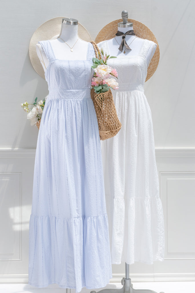 a 100% cotton dress featuring romantic eyelet lace fabric, a higher waistline for a regency-inspired silhouette, a flattering square neckline. A perfect cottagecore and castlecore aesthetic. two dresses view. amantine.